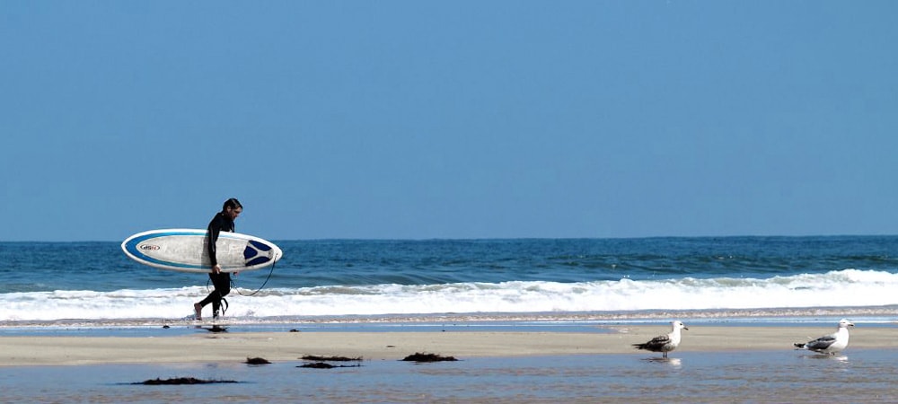 playa Villaviciosa Asturias surfer blue sea beach spain buy real estate property