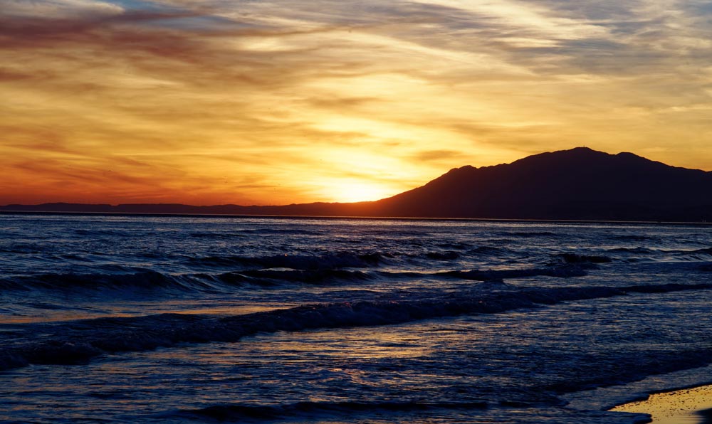 Sunset on the beach under Atalaya property selection.