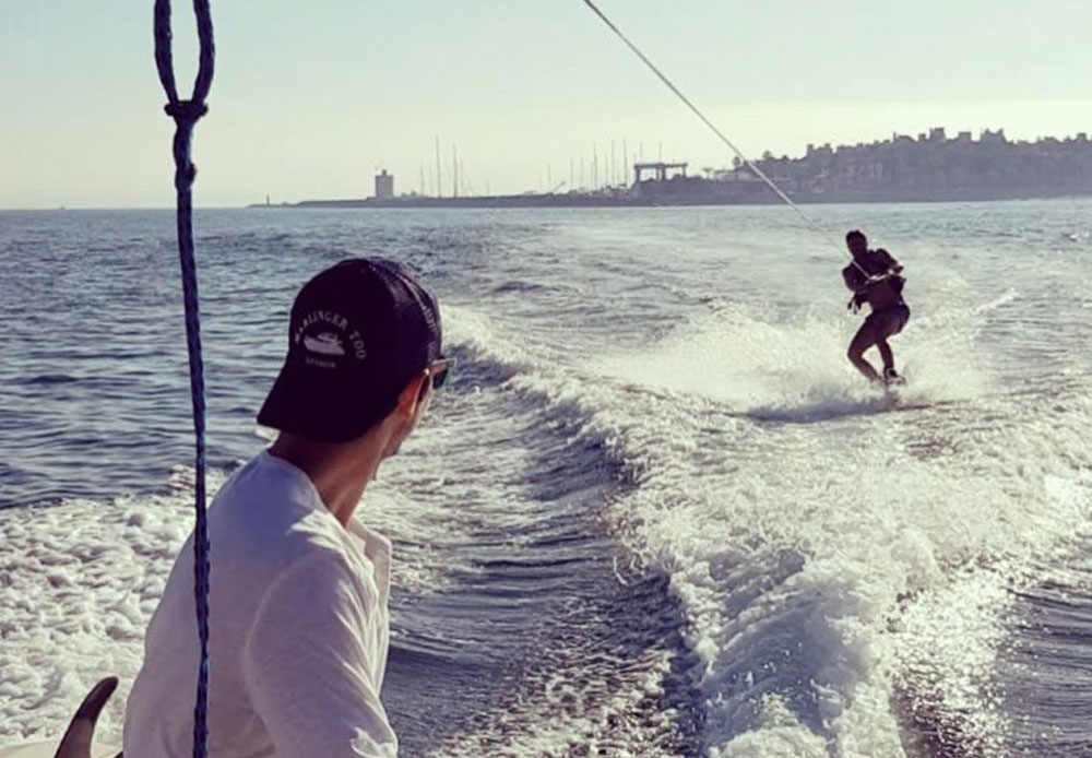 Wakeboarding with Sotogrande Marina property market in the background.